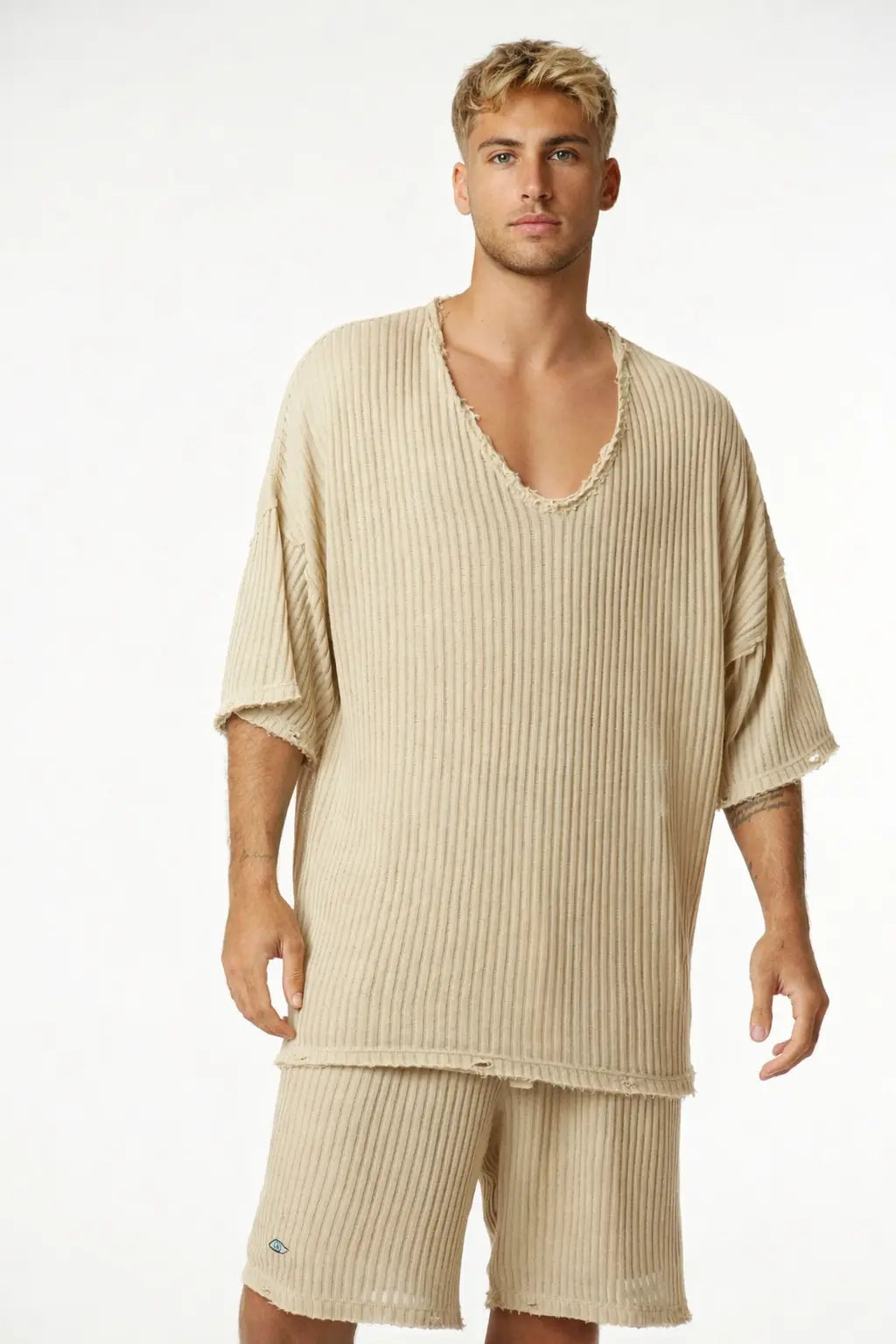 Man wearing a Striped Stone Set with a ribbed beige t-shirt and matching shorts