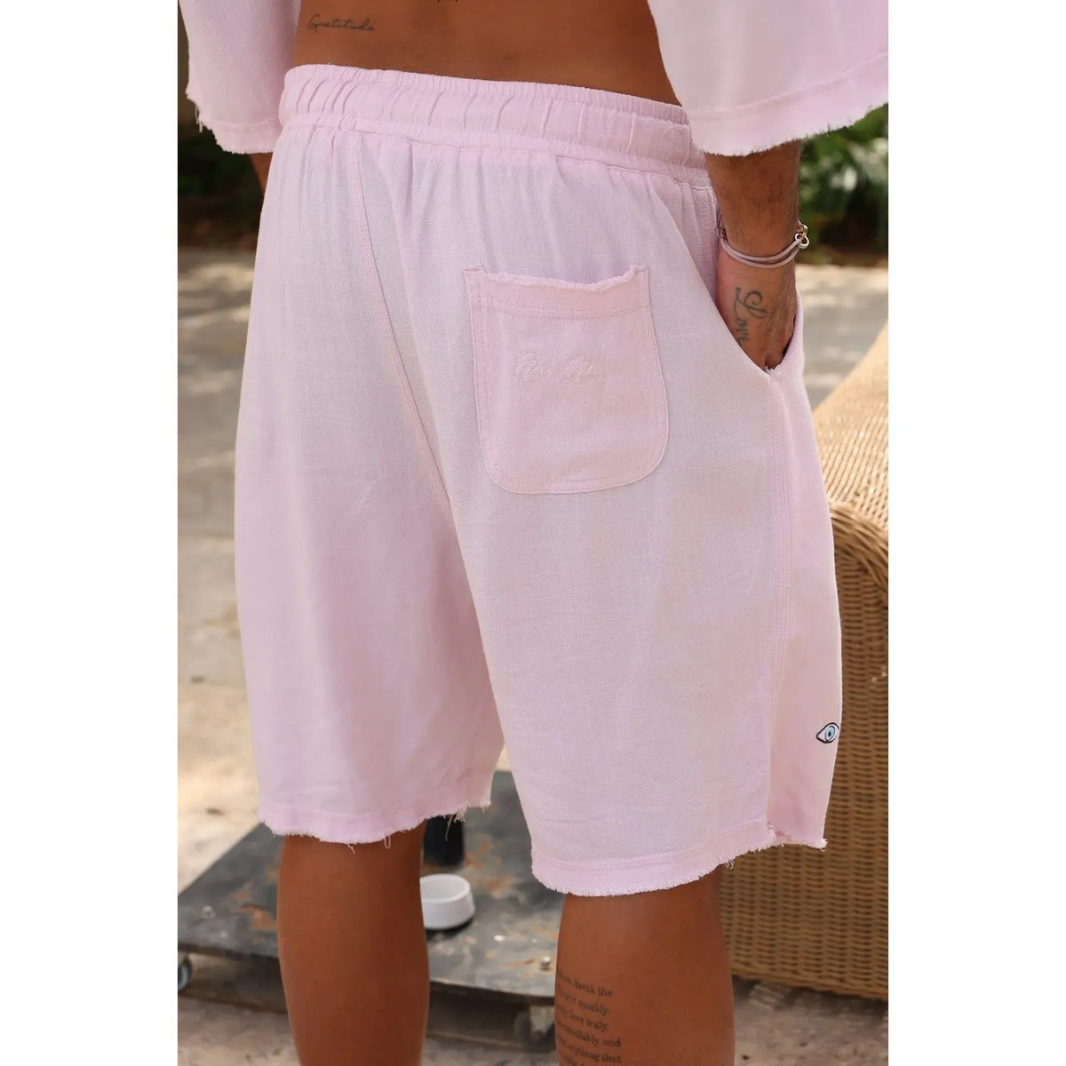 Soft Linen Bermuda Shorts in Baby Pink with an elastic waistband and a back pocket with embroidered logo