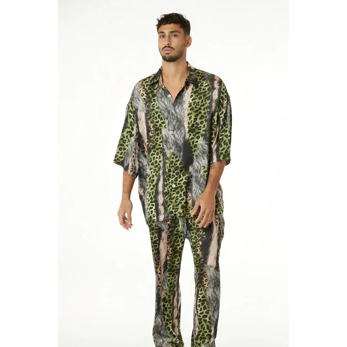 Man wearing Wild Satin Leopard Pants and matching shirt